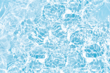 Blue water with ripples on the surface. Defocus blurred transparent blue colored clear calm water surface texture with splashes and bubbles. Water waves with shining pattern texture background.