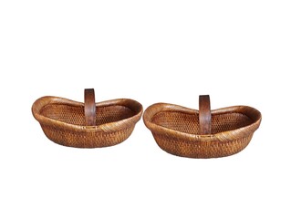 The white background in the picture is a two-layered woven brown rattan basket with a handle in the middle. The basket has a wide, beautiful pattern and is very strong and can be used in the household