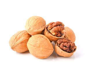 Walnuts and cracked walnut, isolated on white background