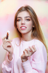 Facial treatment. Woman Face cream. Model enjoying a facial treatment with a cream. Facial skin...