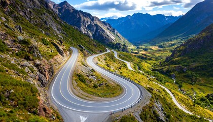 Fototapeta premium Winding mountain road through valley