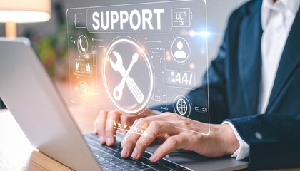 Businessman typing with floating tech support icons overlay.