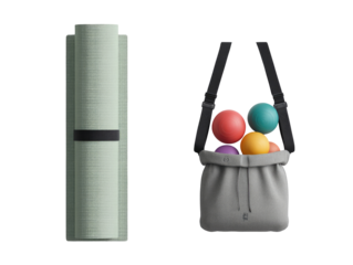 Light sage green yoga mat beside a gray ball carrier bag