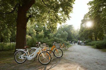 Fototapeta premium scenic view of ecofriendly electric bicycles parked in lush green park inviting people to embrace sustainable