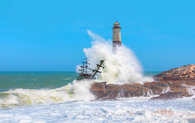 Beautiful red and white lighthouse on the rocks with strong sea wave - Namibia, Africa