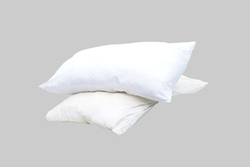 Two white pillows stacked on grey background. Concept, bedroom essentials, fabric cleanliness, home hygiene, and the importance of maintaining sleep health through regular pillow care.