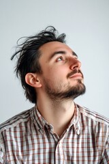 Obraz premium Elegant men's short dreads haircut - midlife white man with black hair. An expressive midlife man with a fashionable style. Pure white solid background. Concept art of style for aging men.