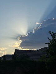 sun rays glowing lightning over the city