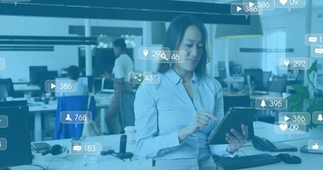 Social media manager scrolling tablet activating floating metrics icons for tracking engagement - Powered by Adobe