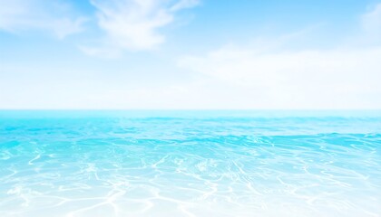 Obraz premium Tranquil ocean scene with a bright blue sky and gently rippling turquoise water