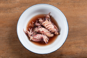 Tom Nam Dam: A boiled squids in ink sauce with squid’s egg in body. Traditional Thai cuisine.