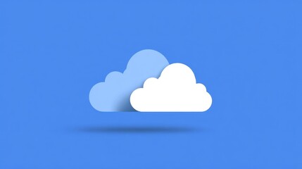 Two fluffy clouds float in the sky, a darker shade one behind a brighter cloud