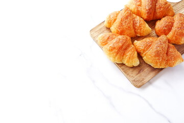 Croissants on a wooden board
