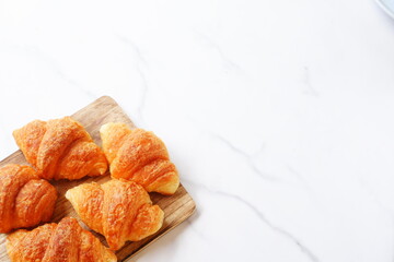 Croissants on a wooden board
