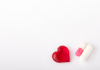capsules with medicine and a heart the concept of medicine with copy space