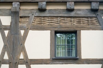 Traditional window in Bavarian timber-frame house facade detail