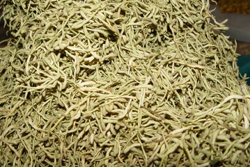 Dried flower buds of Lonicera japonica, a Korean medicinal herb known for antipyretic and detoxifying effects. Photographed in Korea.
