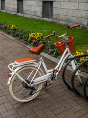 Beautiful retro-style bike in the bike parking lot on the street