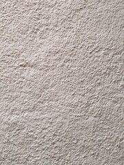 Fototapeta premium Textured wall surface indoor setting image of material neutral colors close-up view surface detail for design use