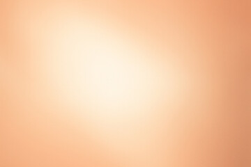 Soft glowing light on a pale apricot background