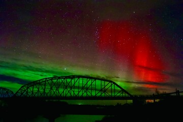 bridge and the red flash aurora borealis at night northern lights missouri river truss bridge 