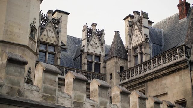 Famous historical streets of Paris with elegant houses and traditional European architecture in the tourist district of the capital of France during the day