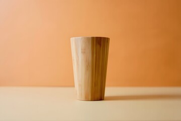 Natural bamboo tumbler with warm orange backdrop drinkware