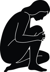 Silhouette of a Person Kneeling and Holding Their Knee in Pain or Sorrow