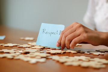 Respect puzzle pieces a thoughtful event understanding and cooperation calm environment close-up view