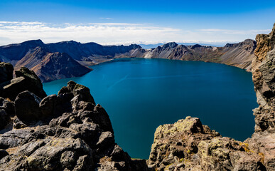 CHANGBAI MOUNTAIN, CHINA - SEPTEMBER 13, 2024: A collection of images showing the stunning view of Cheonji (Heaven Lake), the crater lake of Baekdusan (Mount Paektu), on the border of China and North 