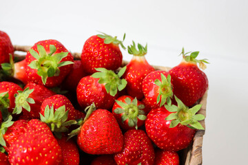 Strawberries in Rustic Basket on White Table