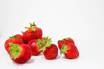 Scattered Strawberries on White Background