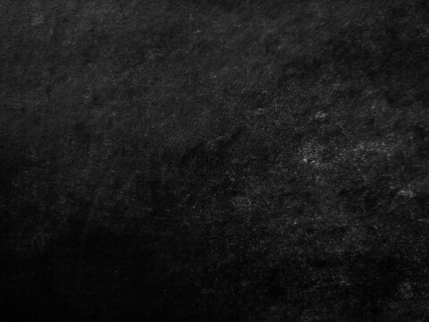 Chalkboard black dirty board background. Chalkboard with white chalk stains for background or copy space perfect for school themed or retro visuals. White chalk dust on a black chalkboard.
