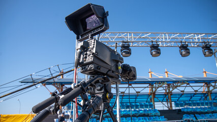 TV camera on the street shooting.