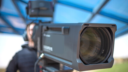 TV camera on the street shooting.