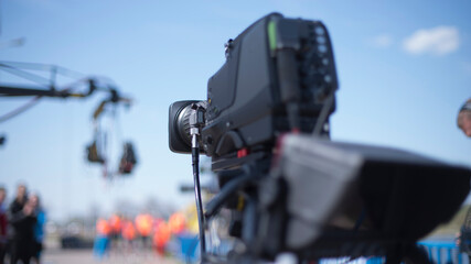 TV camera on the street shooting.