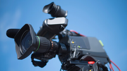TV camera filming a story on the street