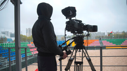 TV camera on the street shooting.