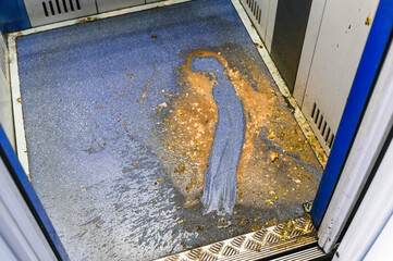 vomit  in the elevator