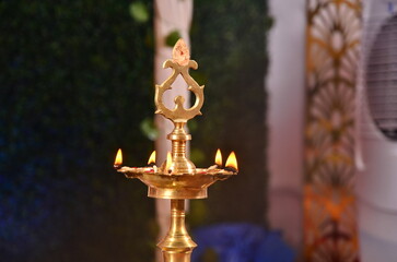 photography of a pooja lamp kuthu vilakku