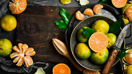 A bowl of juicy orange tangerines. Citrus fruits are rich in vitamin C. Autumn fruits.