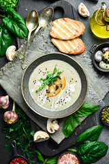 Mushroom cream soup of champignons with cream. In a bowl. Healthy food concept. Close up.