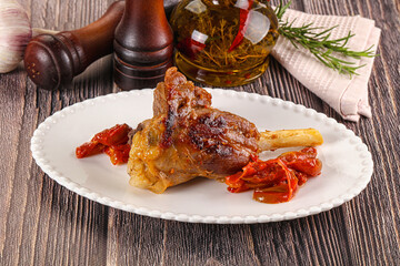 Baked lamb shank with vegetables