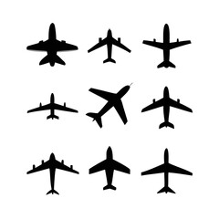A diverse collection of airplane silhouettes showcasing various aircraft designs and flight orientations, isolated on white background