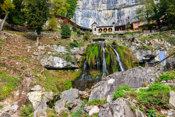St. Beatus Waterfall at  St. Beatus Caves entrance in Beatenberg, Bernese Oberland, Switzerland