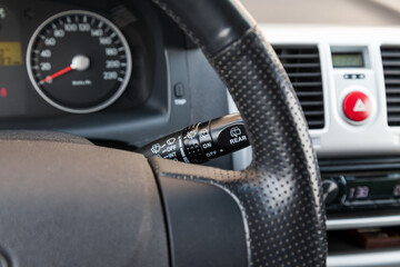 Wiper mode selection button with automatic adjustment through the rain sensor on the steering...