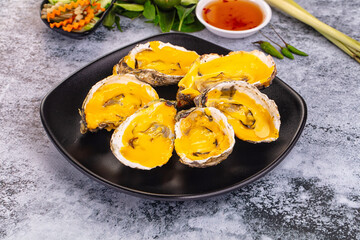 Baked oyster with cheddar cheese