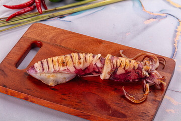 Tasty grilled wild squid with lime