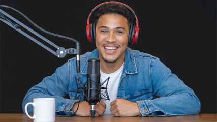 Man with headphones and microphone in podcast studio