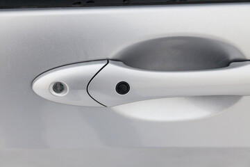 car door handle with rubber keyless entry button to open the vehicle without looking for the key in...
